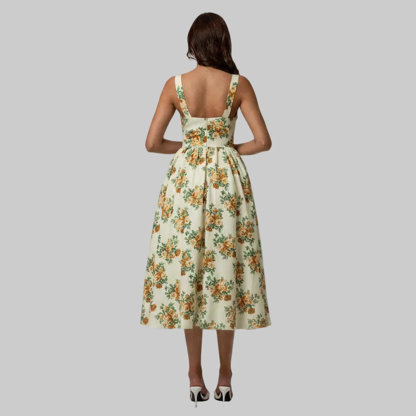 Woman wearing a floral dress with a plain background