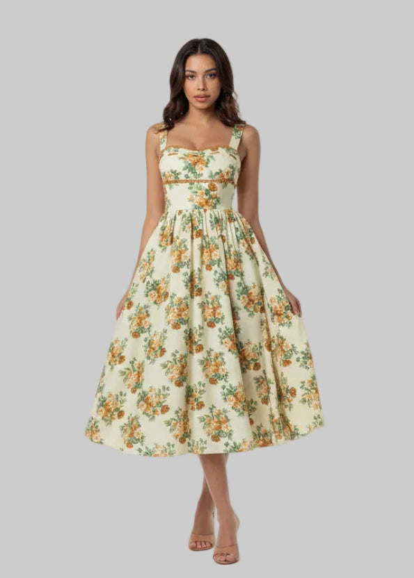Floral dress with orange and green flowers on a plain background