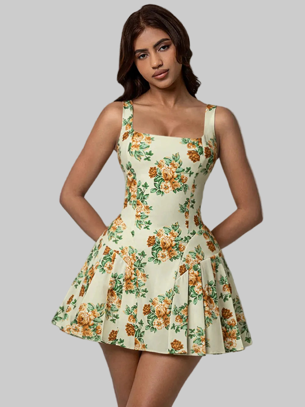 Woman wearing a floral dress against a gray background