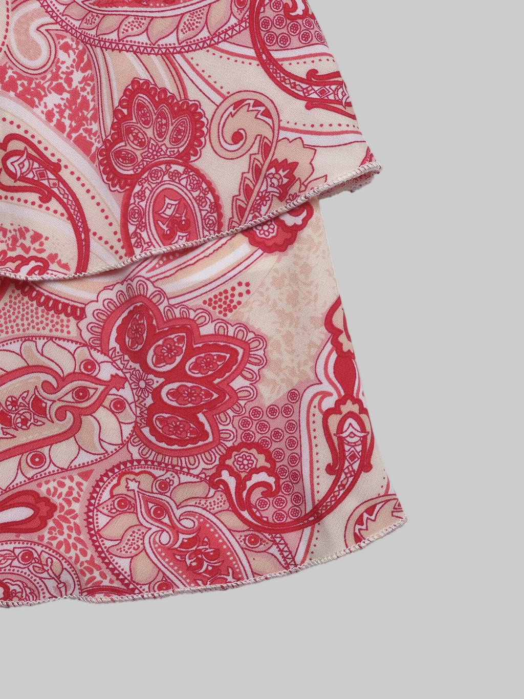 Close-up of a red and beige patterned fabric