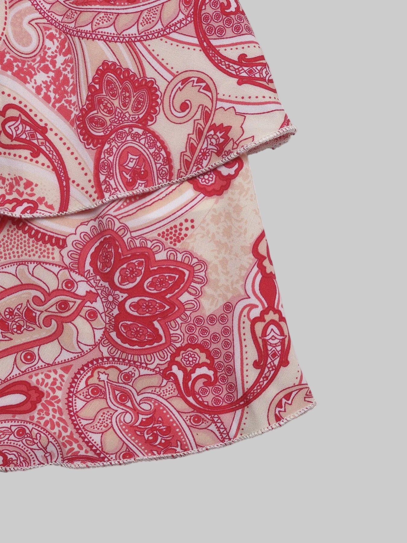 Close-up of a red and beige patterned fabric