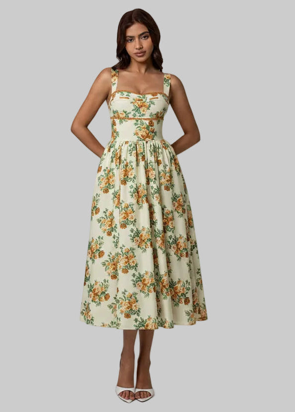Woman wearing a floral dress against a gray background