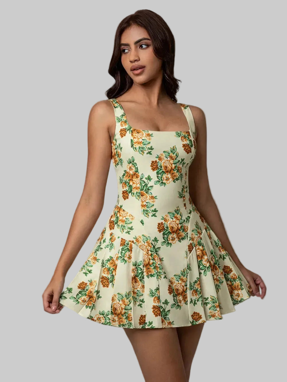 Woman wearing a floral dress against a neutral background